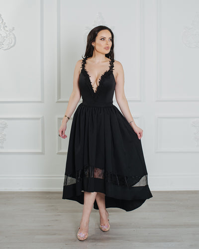 Sexy and sophisticated midi length dress with a deep V-plunge.